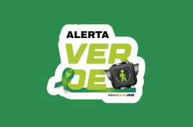 Quadro verde, com a logomarca do movimento Abril Verde no centro, inspirada em um semáforo; os dizeres  Alerta em preto, Verde em letras maiores e a fita verde do movimento na parte inferior.